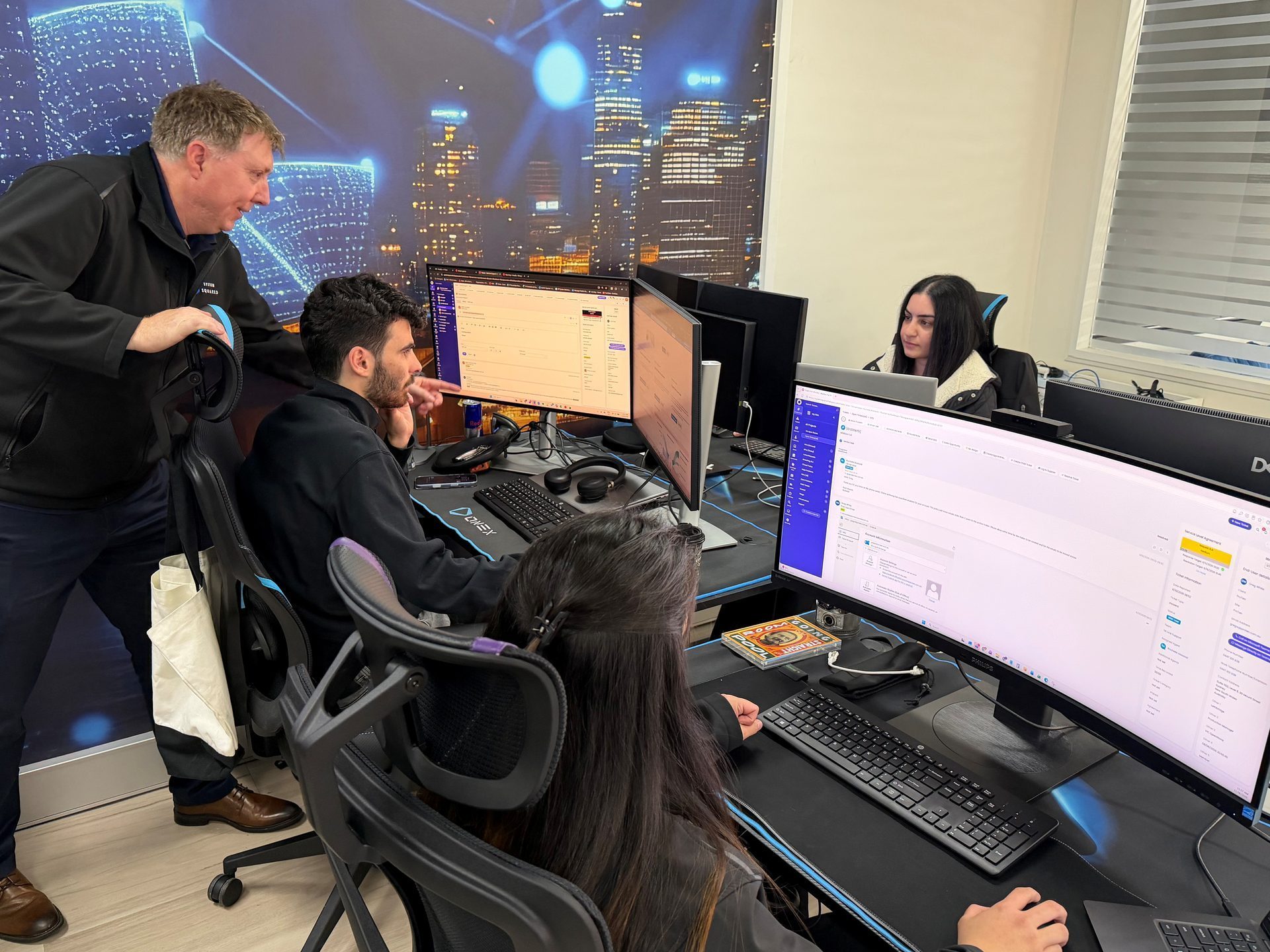 System Squared managed services team at their workstations